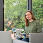 Computer science Kaylee Swenson sitting in study lounge